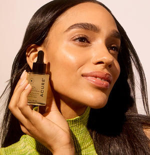 Acure Brightening 2% Vitamin C + Ferulic Acid Serum with Model