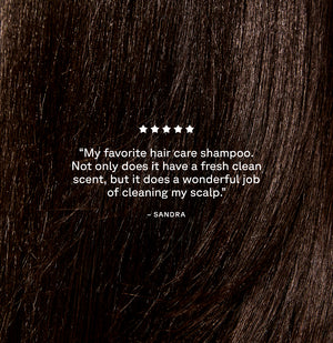 Close-up of dark brown hair with a five-star rating and review text overlay.