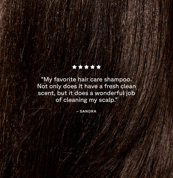 Close-up of dark brown hair with a five-star rating and review text overlay.