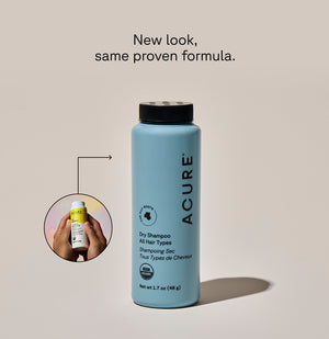 Acure dry shampoo bottle with text 'New look, same proven formula.' on a beige background